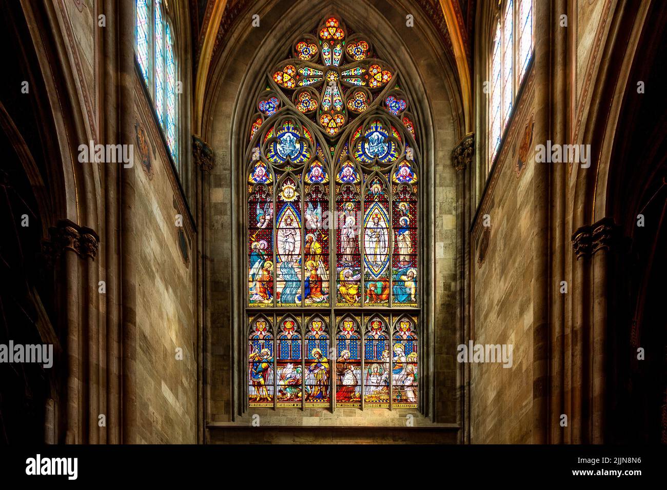 A beautiful stained glass arch window in the church Stock Photo Alamy