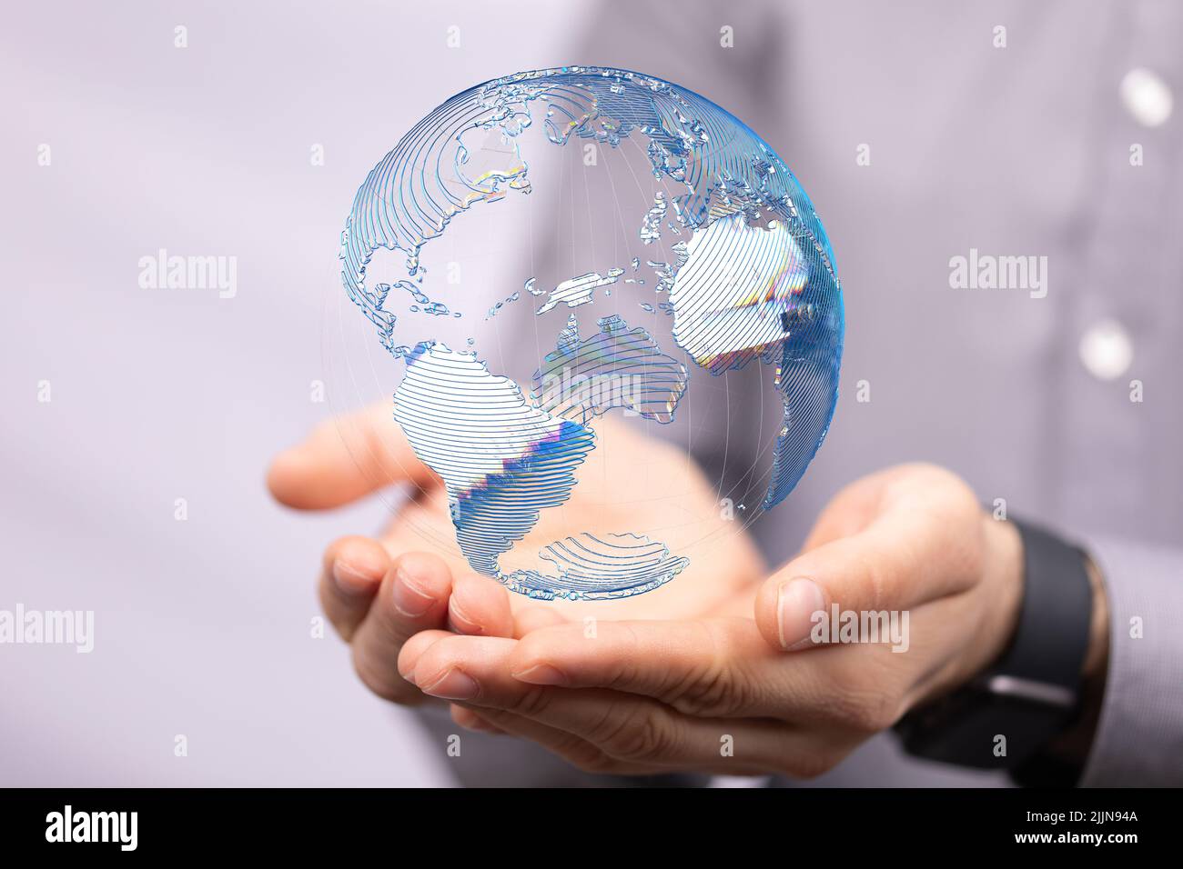 a photo of 3d rendered earth floating over man hands Stock Photo - Alamy
