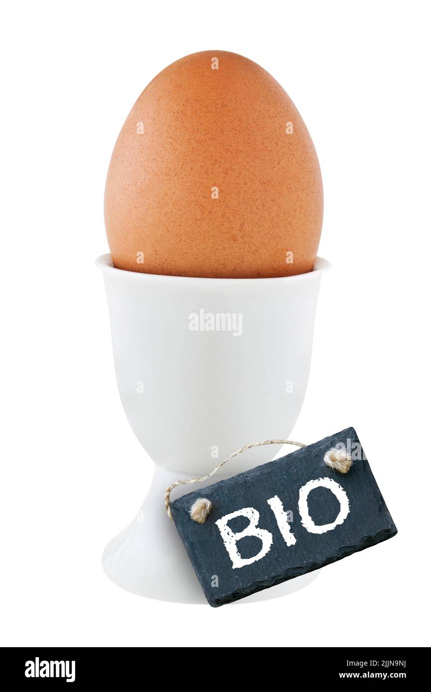 1 organic bio egg and eggcup with label isolated on white background Stock Photo