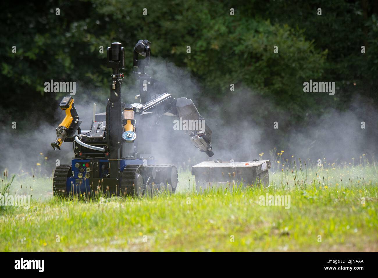 Mellenthin, Germany. 27th July, 2022. A remote-controlled manipulator drives toward an ammunition box for training purposes on the premises of the Ammunition Salvage Service on the island of Usedom. The special vehicle is intended for defusing so-called unconventional explosive and incendiary devices as well as suitcase bombs or letter bombs. The Ammunition Salvage Service is reportedly responsible for the disposal of all ordnance or explosive weapons of war. Credit: Stefan Sauer/dpa/Alamy Live News Stock Photo