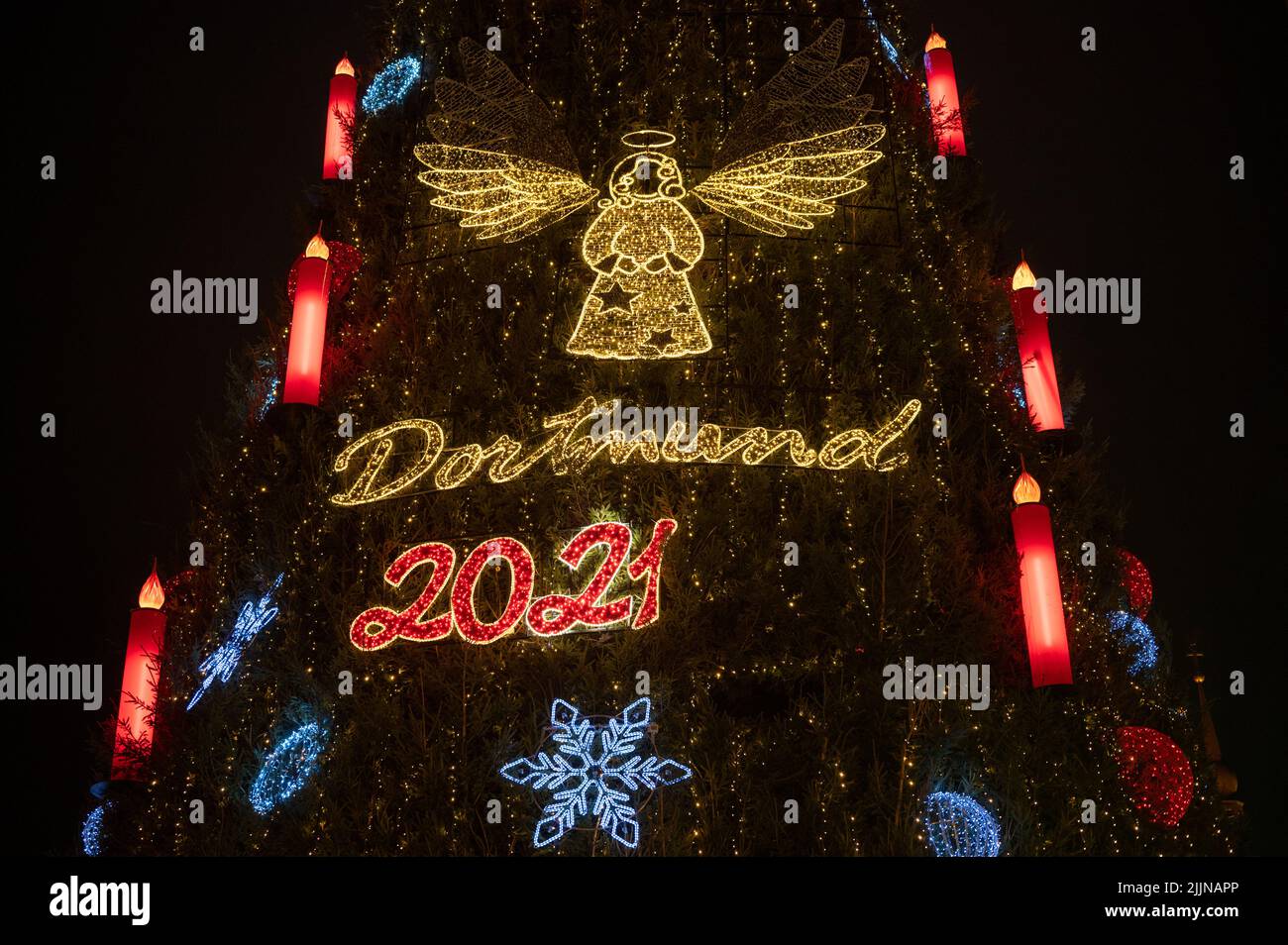 The beautiful Christmas angel and other decorations on the tree in Dortmund Christmas Market 2021. Stock Photo