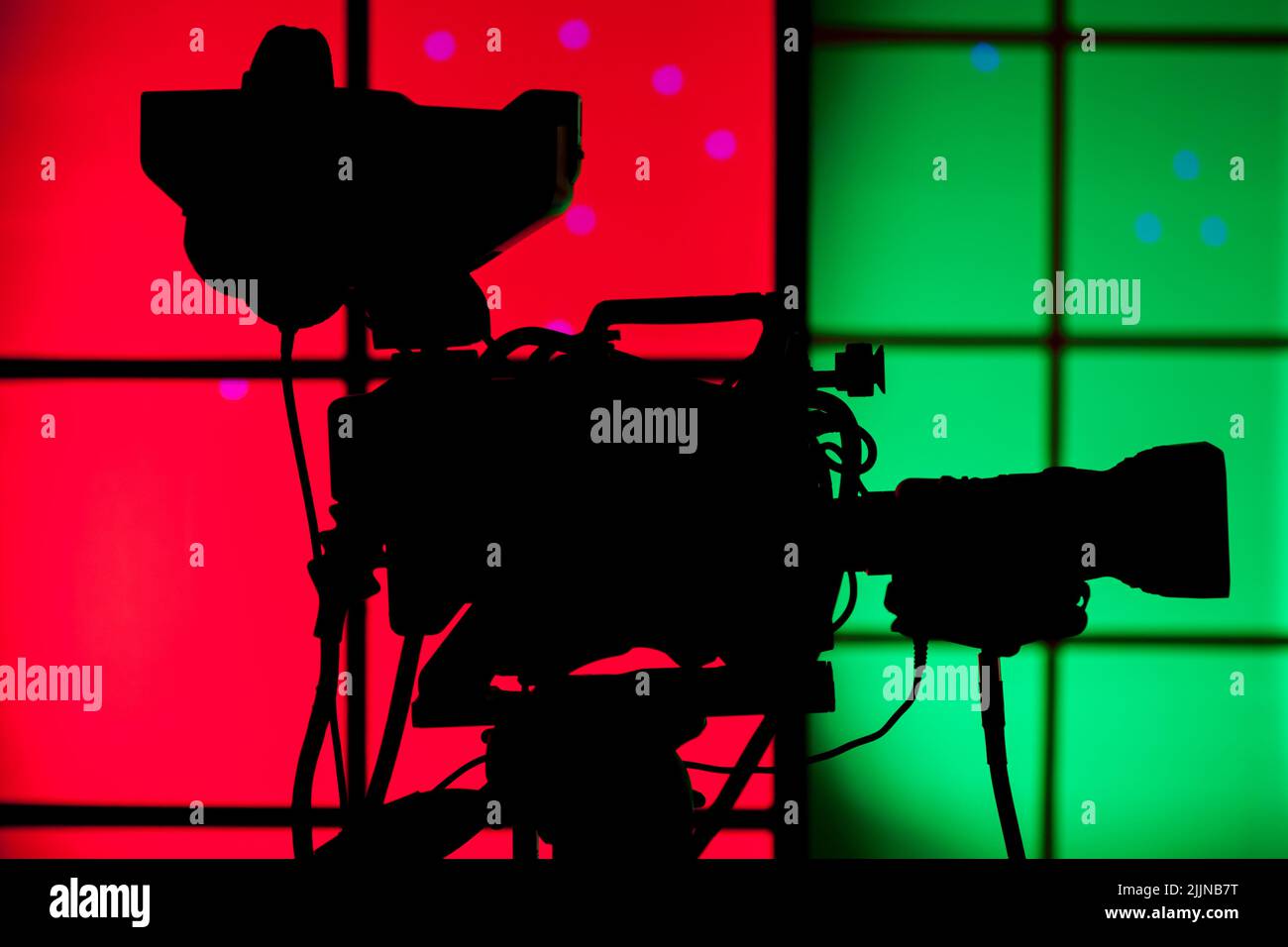 A professional TV camera with red and green background Stock Photo
