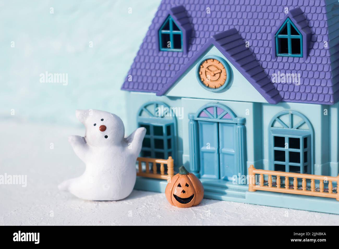 Smiling Pumpkin, ghost with playhouse Stock Photo