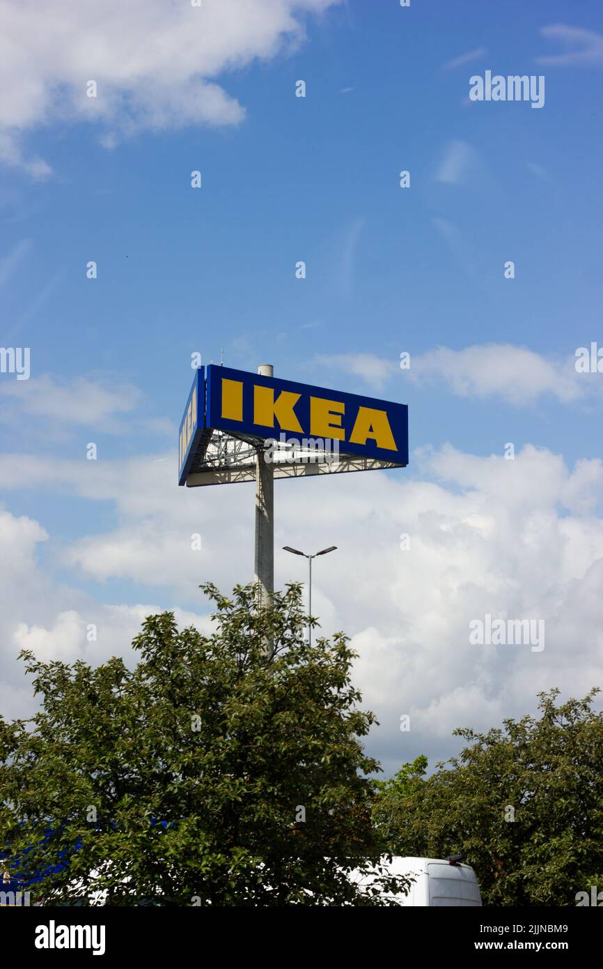 A vertical sot of IKEA sign in Berlin, Waltersdorf, Germany on cloudy