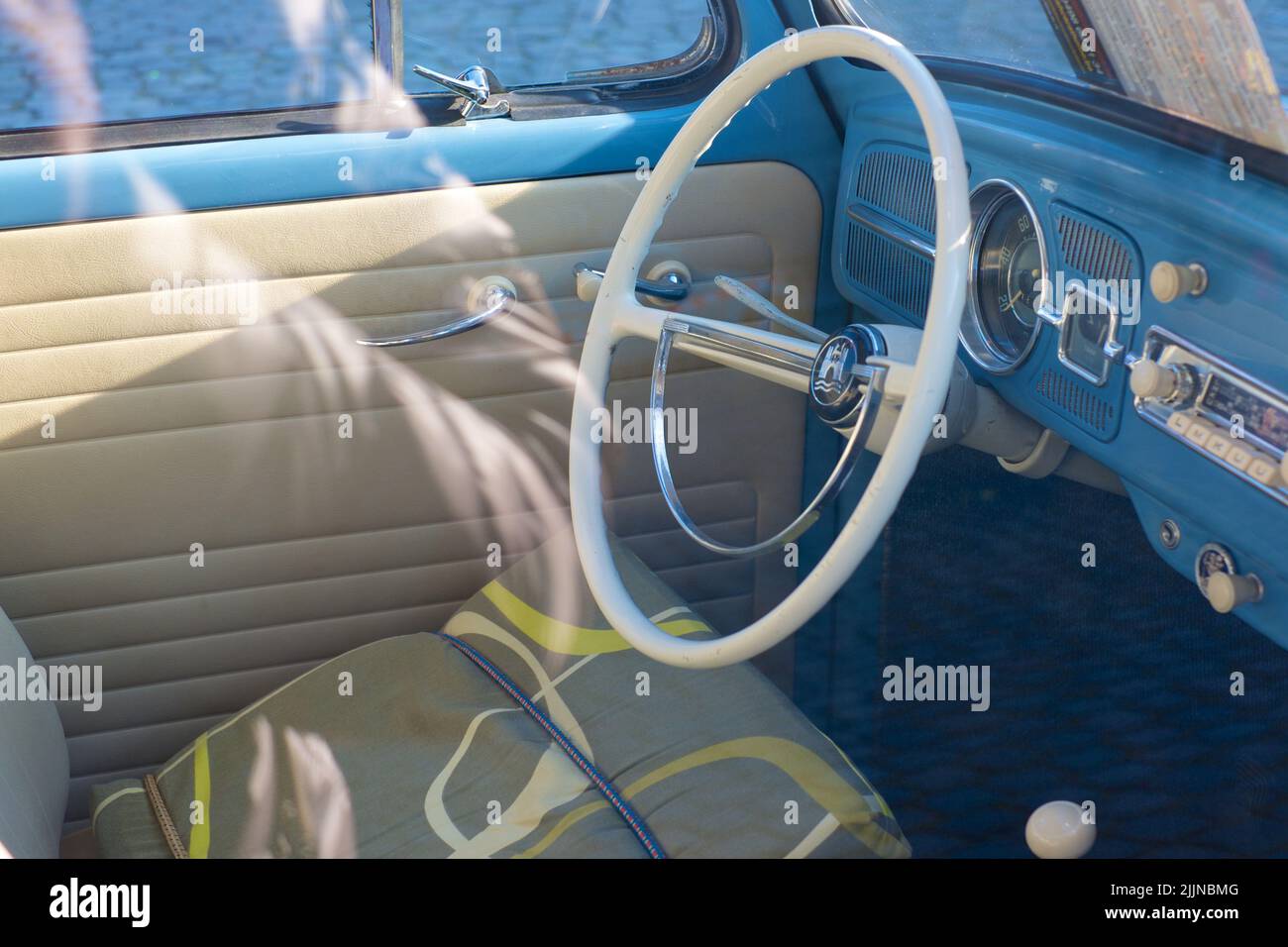 The beautiful interior of a retro blue Volkswagen Beetle car on the street in Brussels Stock Photo