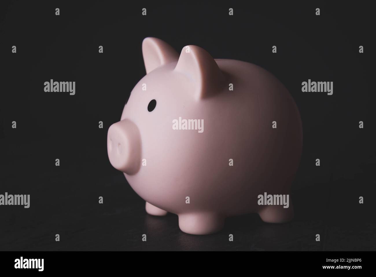 Accumulation of money. Storing coins in a piggy bank. Interest