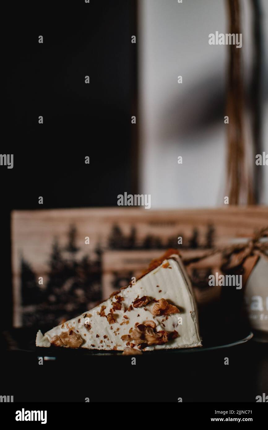 A vertical shot of a piece of cake on a plate. Stock Photo