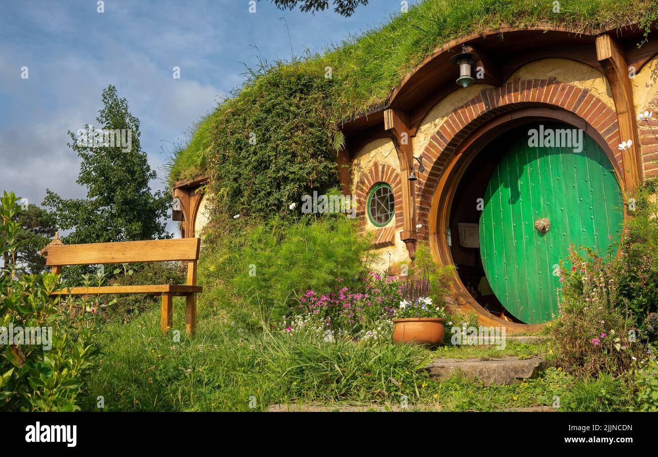 A closeup of the Iconic round green door in Hobbiton, New Zealand Stock Photo