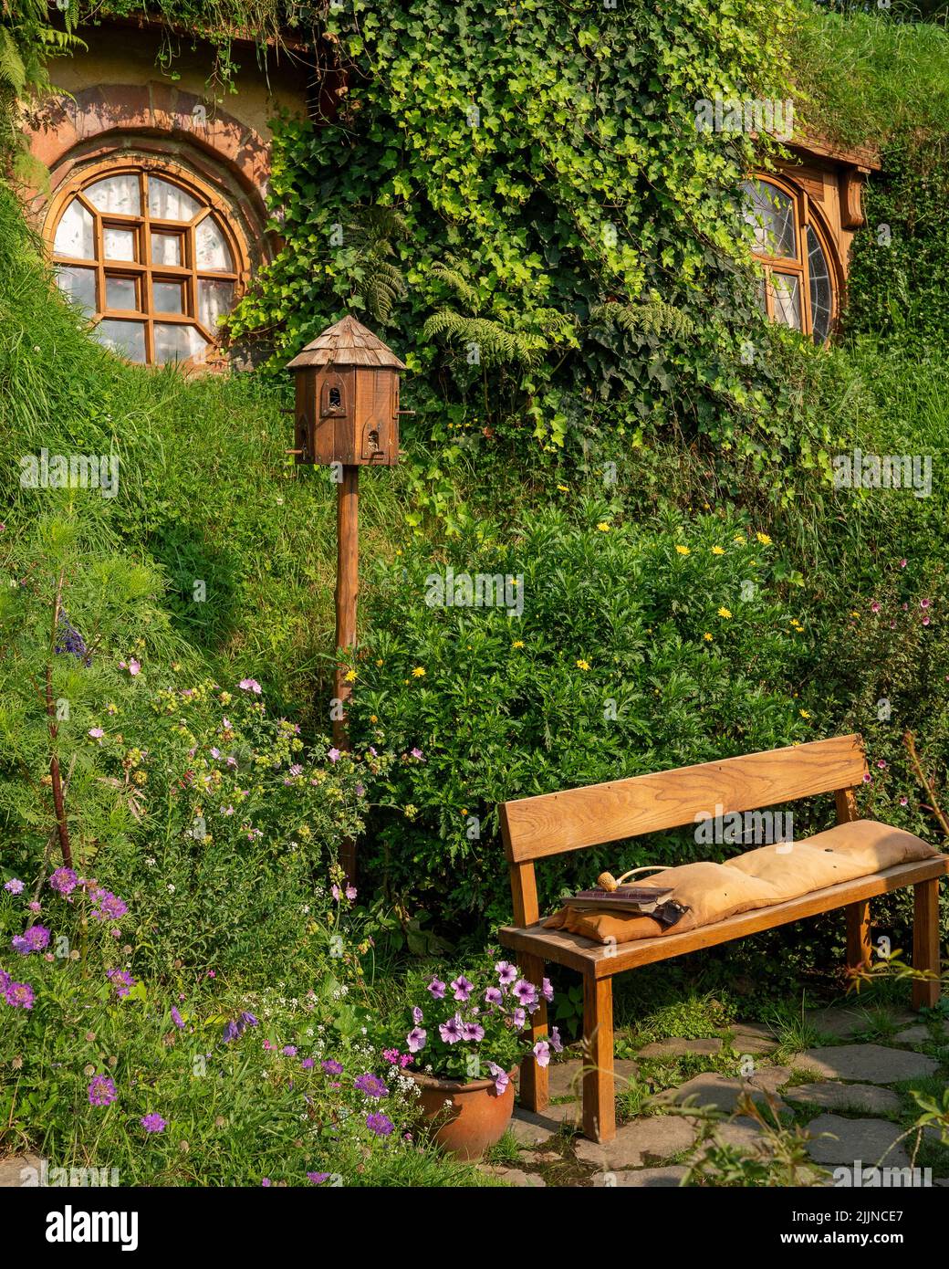 A closeup of an Iconic wooden bench in Hobbiton, New Zealand Stock Photo