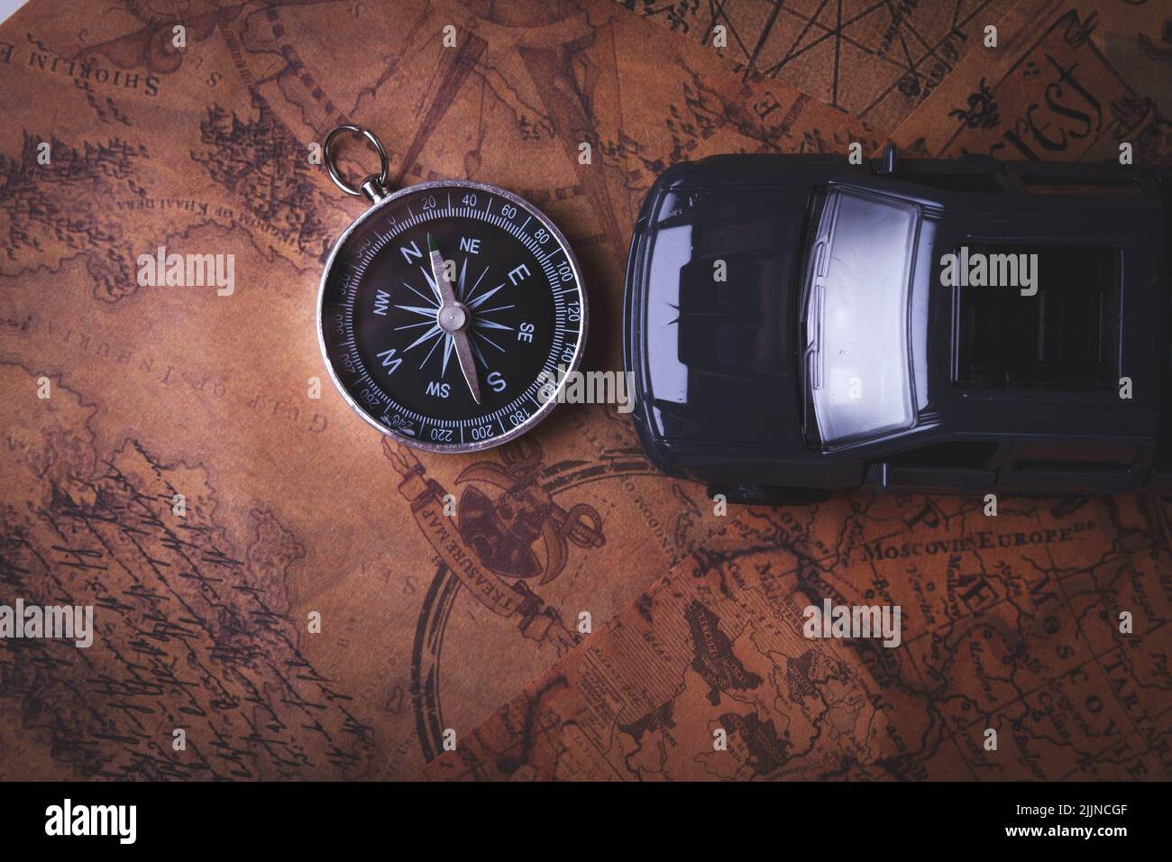 Tourist travel by car. Travel by car. Compass and car. Autotourism
