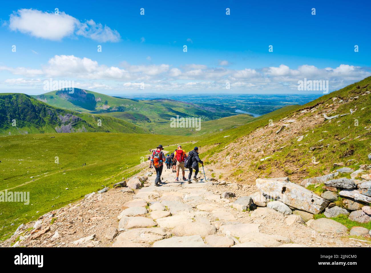 SNOWDON, WALES JULY 09, 2022 Hikers walk dawn from Mount Snowdon