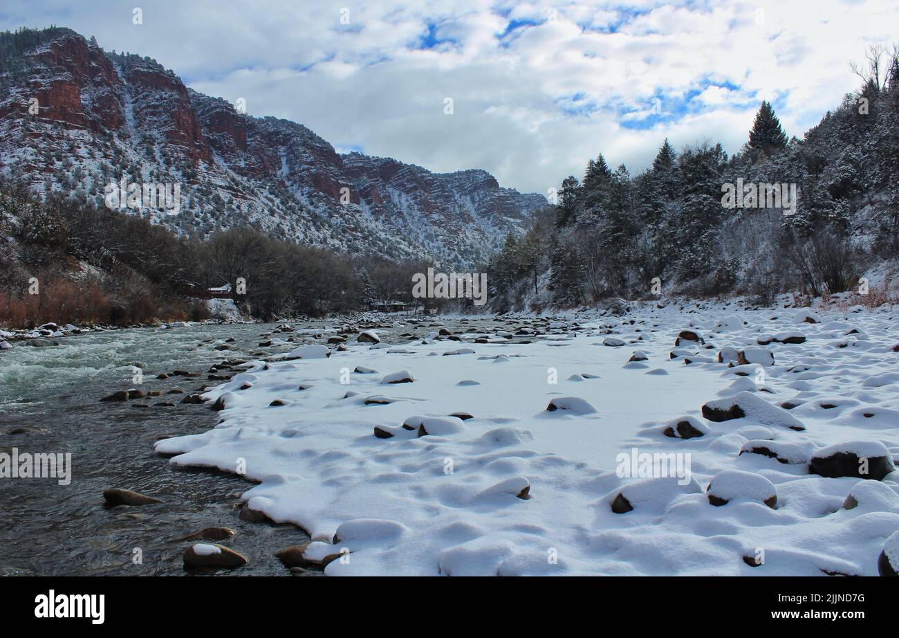 Snow and river in a forest snow mountain winter landscape hi-res stock ...
