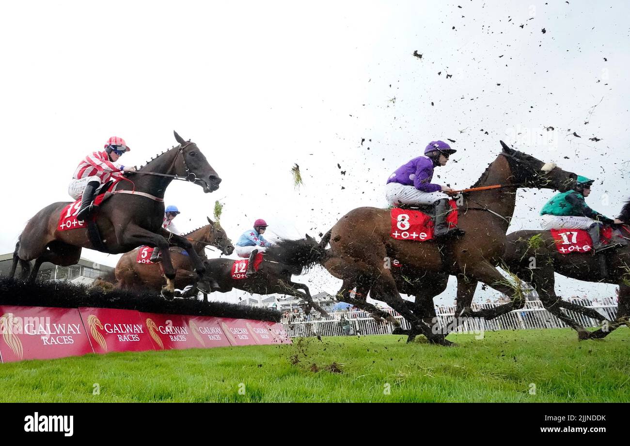 Outback Flyer and jockey Kevin Sexton (right, purple) on the way to winning the Free Jackpot All Customers At Tote.ie Irish EBF Mares Handicap Hurdle during day three of the Galway Races Summer Festival 2022 at Galway Racecourse in County Galway, Ireland. Picture date: Wednesday July 27, 2022. Stock Photo