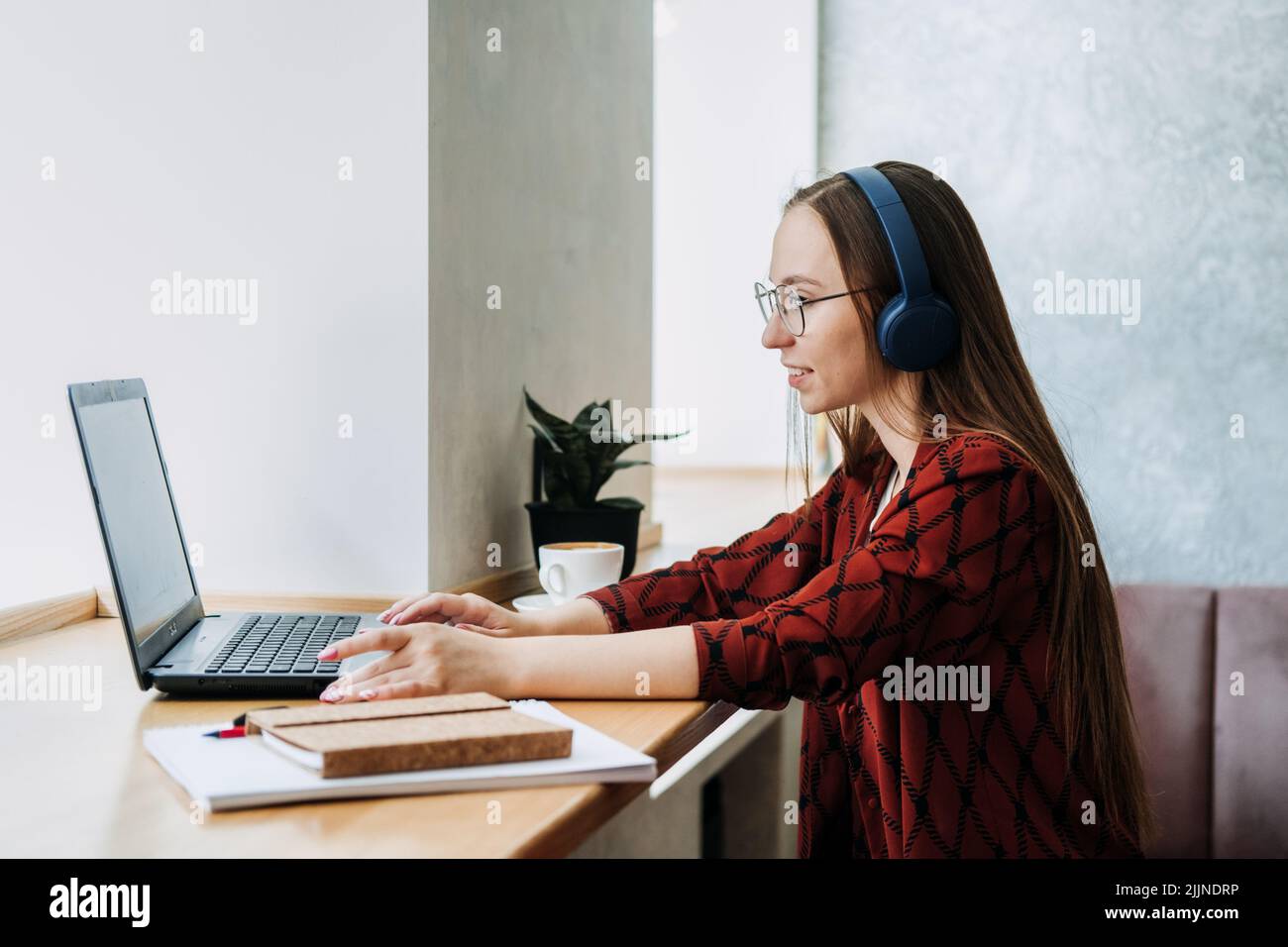 Outsourcing IT Projects, remote work, young professionals. female young programmer, developer working Stock Photo