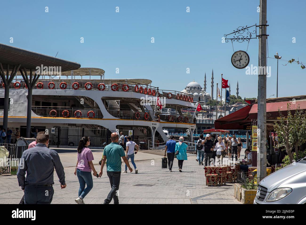 The crowd of people at Karakoy dock and its surroundings is less compared to other days due to the high temperatures. Stock Photo