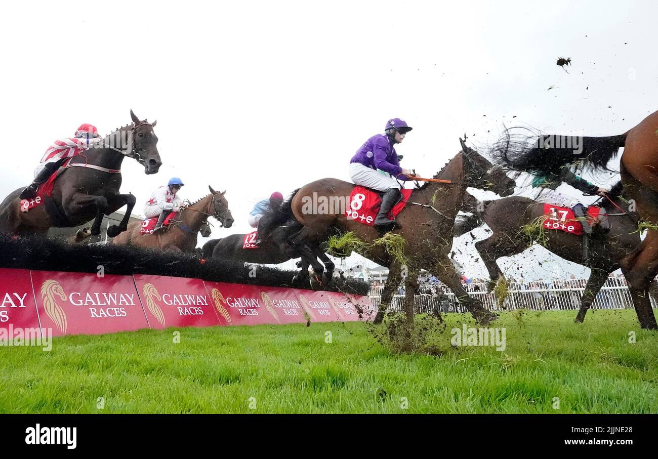 Outback Flyer and jockey Kevin Sexton (centre, purple) on the way to winning the Free Jackpot All Customers At Tote.ie Irish EBF Mares Handicap Hurdle during day three of the Galway Races Summer Festival 2022 at Galway Racecourse in County Galway, Ireland. Picture date: Wednesday July 27, 2022. Stock Photo