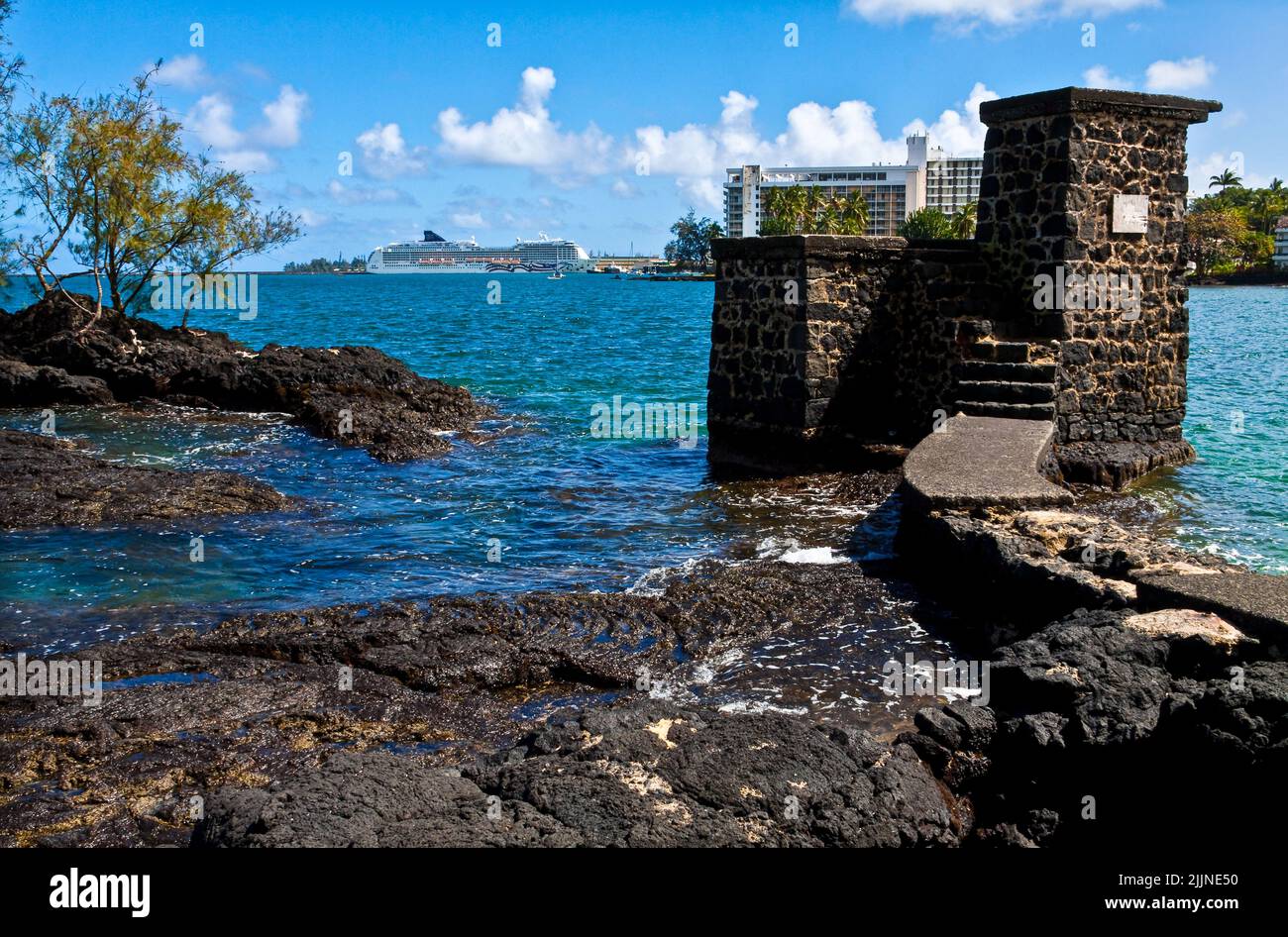 Cruise Ship at Port and Old Tower From  Coconut Island Park, Hilo, Hawaii, USA Stock Photo