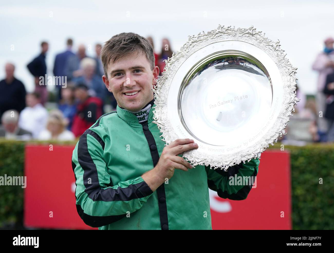 Jockey Jordan Gainford holds the trophy after winning the Tote Galway Plate on Hewick during day three of the Galway Races Summer Festival 2022 at Galway Racecourse in County Galway, Ireland. Picture date: Wednesday July 27, 2022. Stock Photo