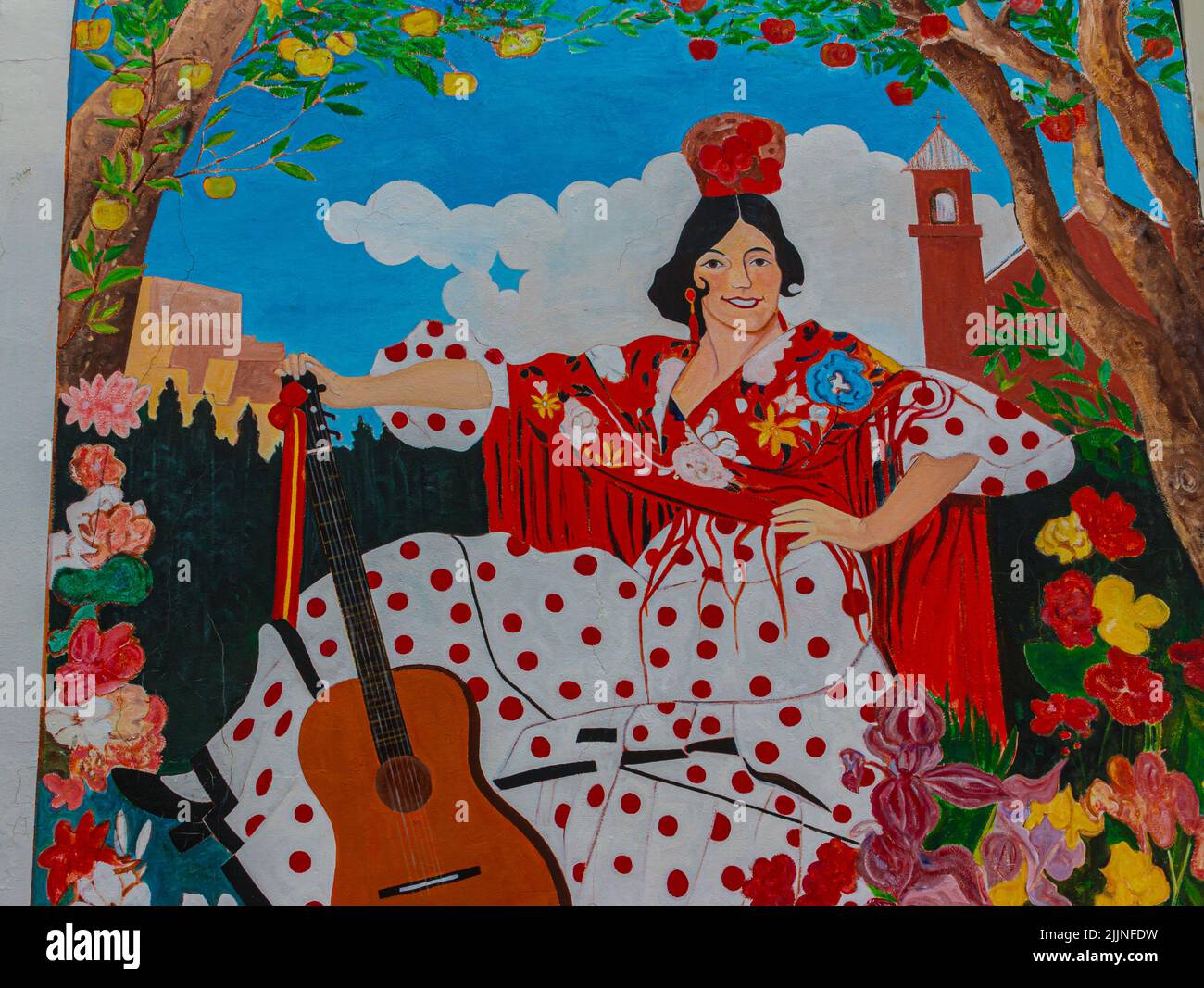 Mural of Spanish Maiden Painted on Adobe Wall, Espanola, New Mexico, USA Stock Photo