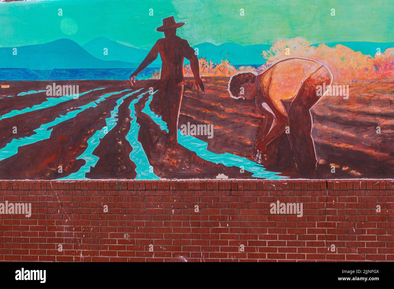 Mural Depicting Early Farming Life Painted on Adobe Wall, Espanola, New Mexico, USA Stock Photo