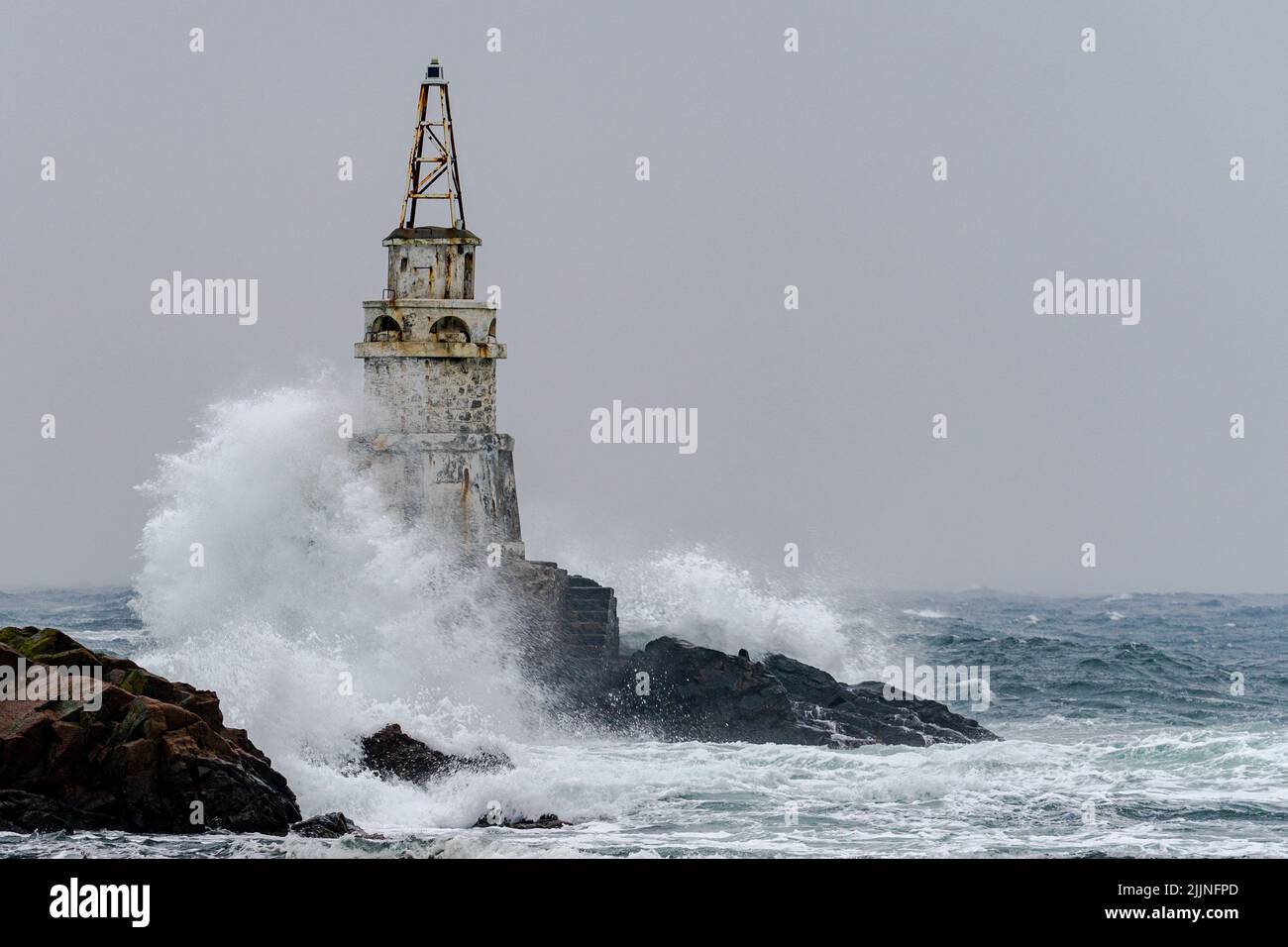 A big storm near an old lighthouse in Achtopol bay, Black sea, Bulgaria Stock Photo
