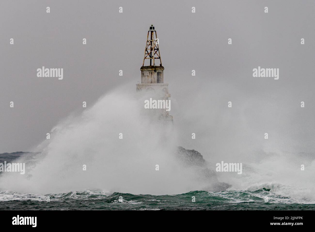 A big storm near an old lighthouse in Achtopol bay, Black sea, Bulgaria Stock Photo