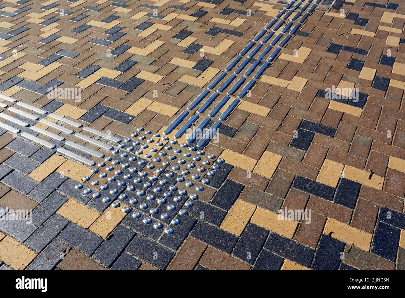 Modern design stylish colorful paving area with metal tactile tiles for