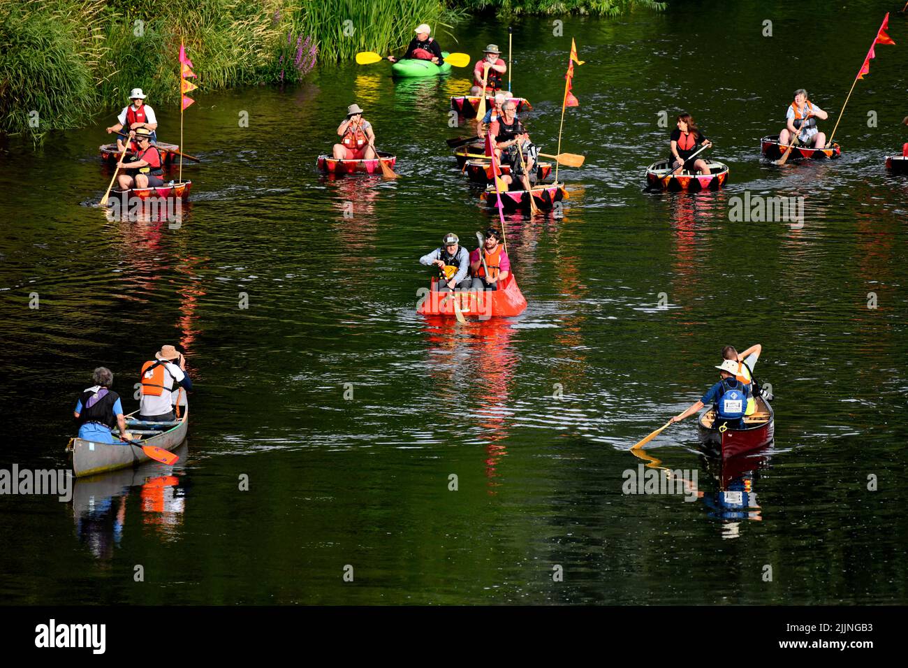 Queen's Baton Relay. The Commonwealth Games Queen's Baton Relay passing through Ironbridge in Shropshire. The baton travelled by coracle on the River Stock Photo