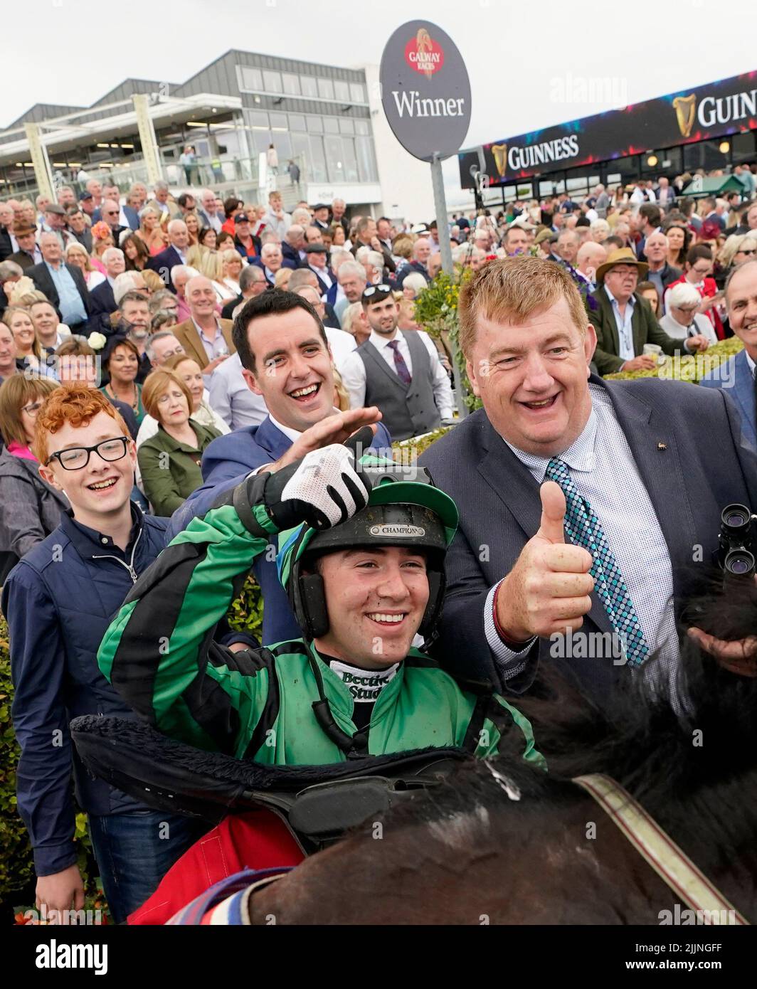 Hewick's Trainer John Hanlon and Jockey Jordan Gainford in the parade ring after winning the The Tote Galway Plate during day three of the Galway Races Summer Festival 2022 at Galway Racecourse in County Galway, Ireland. Picture date: Wednesday July 27, 2022. Stock Photo