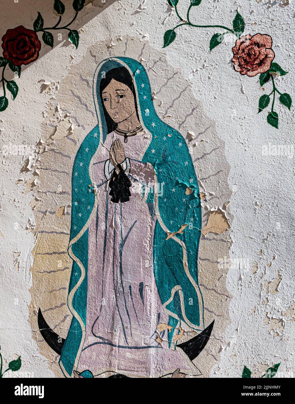 Mural Painted On The Wall of The Santo Nino Chapel at Sanctuario de Chimayo, Chimayo, New Mexico, USA Stock Photo