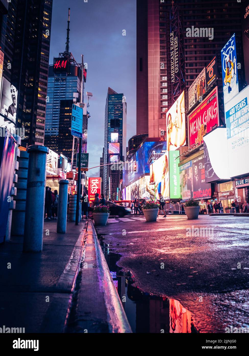 A vertical shot of the nightlife in New York City Time Square with