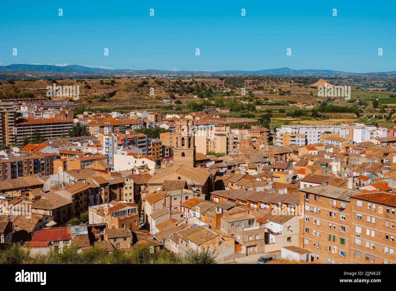 an aerial view of the old town of Monzon, in the Huesca province of Aragon, Spain, highlighting the bell tower of the Cathedral of Santa Maria del Rom Stock Photo
