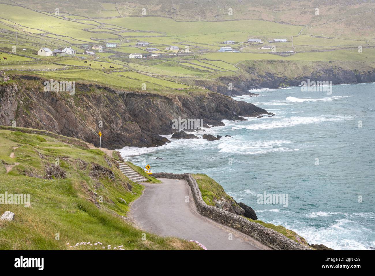 The Road to Coumeenoole Beach at high tide in County Kerry, Ireland Stock Photo