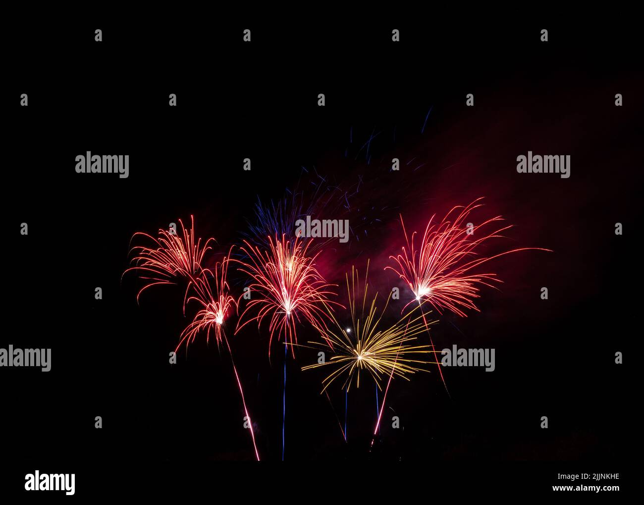 A horizontal view of a beautiful firework in night black sky Stock Photo