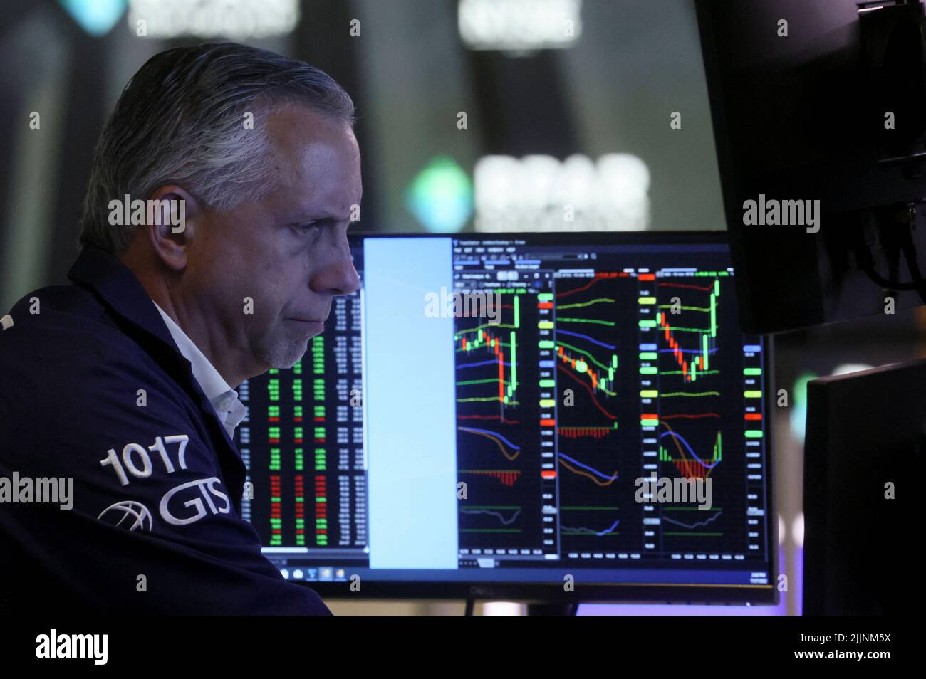A trader works on the floor of the New York Stock Exchange (NYSE) following a Fed rate announcement, in New York City, U.S., July 27, 2022. REUTERS/Brendan McDermid Stock Photo