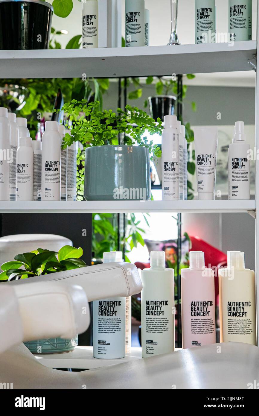 A vertical closeup of Authentic Beauty Concept products on display in hair salon in Cape Town, South Africa Stock Photo