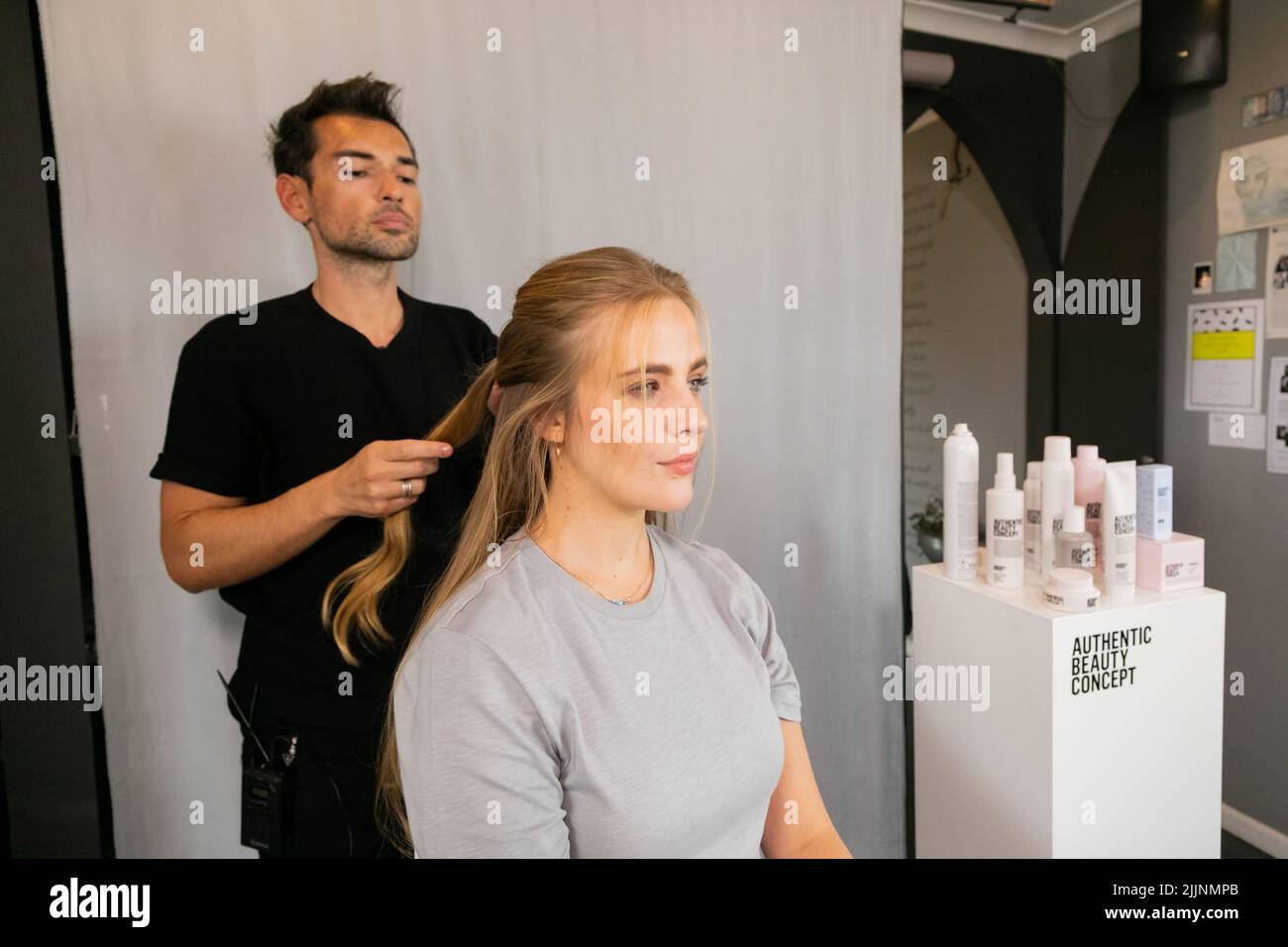 A celebrity hairstylist Marios Atzemoglou using Authentic Beauty Concept products Stock Photo