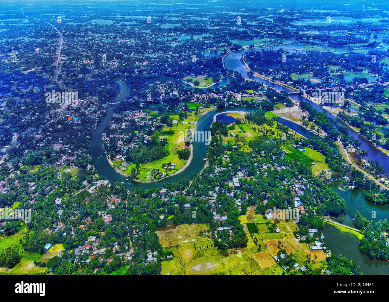 an-aerial-view-of-the-flowing-karnaphuli-river-surrounded-by-greens-in