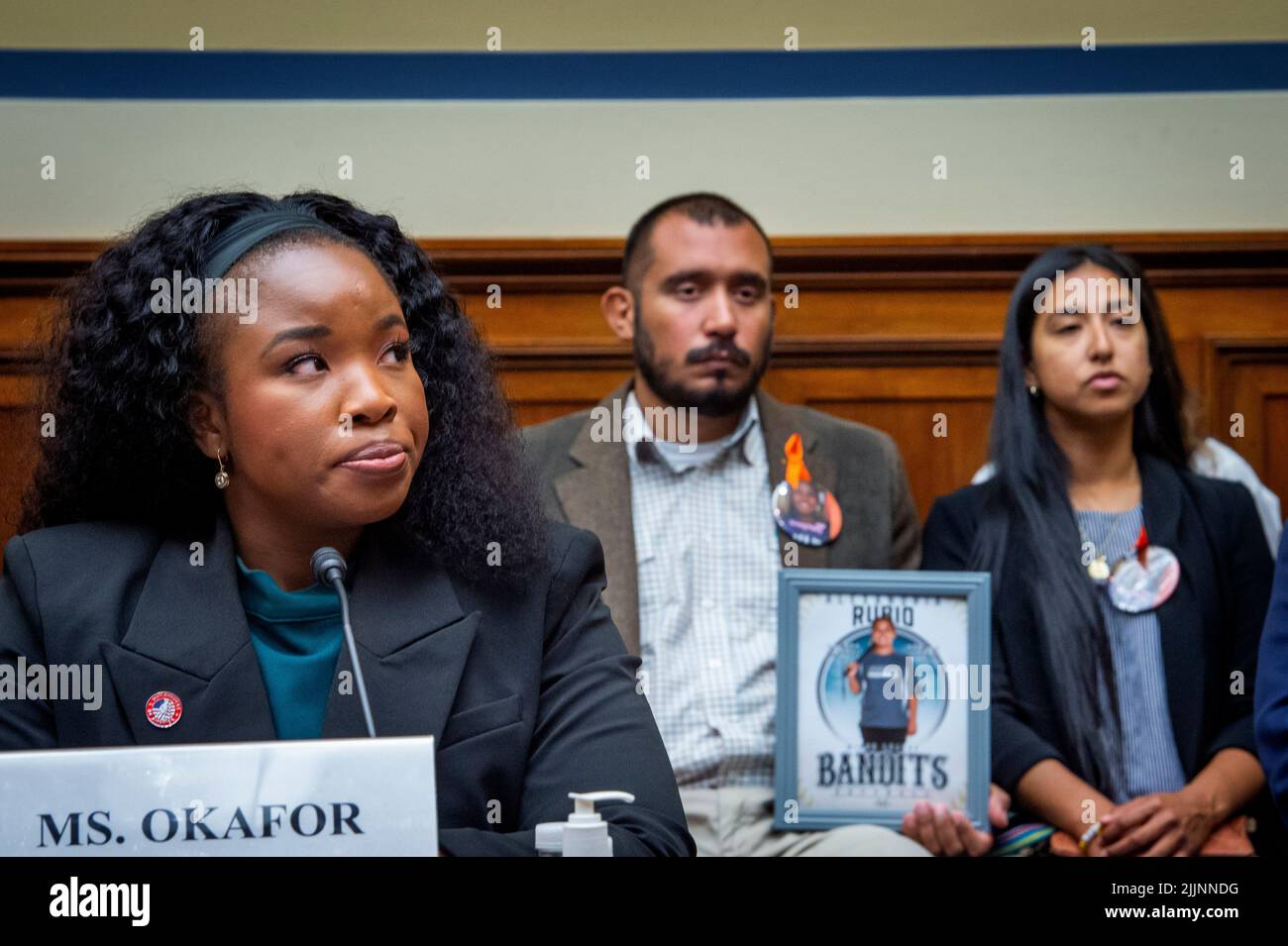 Felix Rubio, center, and Kimberly Rubio, right, whose daughter Alexandria Rubio was one of the children killed by a gunman at Robb Elementary School in Uvalde, Texas, listen to remarks by Antonia Okafor, National Director of Women's Outreach at Gun Owners of America, left, during a House Committee on Oversight and Reform hearing “Examining the Practices and Profits of Gun Manufacturers” in the Rayburn House Office Building in Washington, DC, July 27, 2022. Credit: Rod Lamkey/CNP /MediaPunch Stock Photo