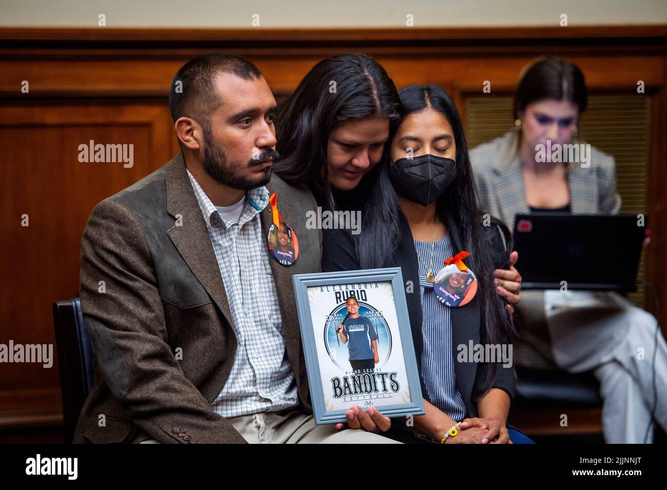 Gloria Cazares, center, whose nine year-old daughter Jacklyn was one of the children killed by a gunman at Robb Elementary School in Uvalde, Texas, comforts Felix Rubio, left, and Kimberly Rubio, right, whose daughter Alexandria Rubio was one of the children killed by a gunman at Robb Elementary School in Uvalde, Texas, during a House Committee on Oversight and Reform hearing “Examining the Practices and Profits of Gun Manufacturers” in the Rayburn House Office Building in Washington, DC, July 27, 2022. Credit: Rod Lamkey/CNP /MediaPunch Stock Photo