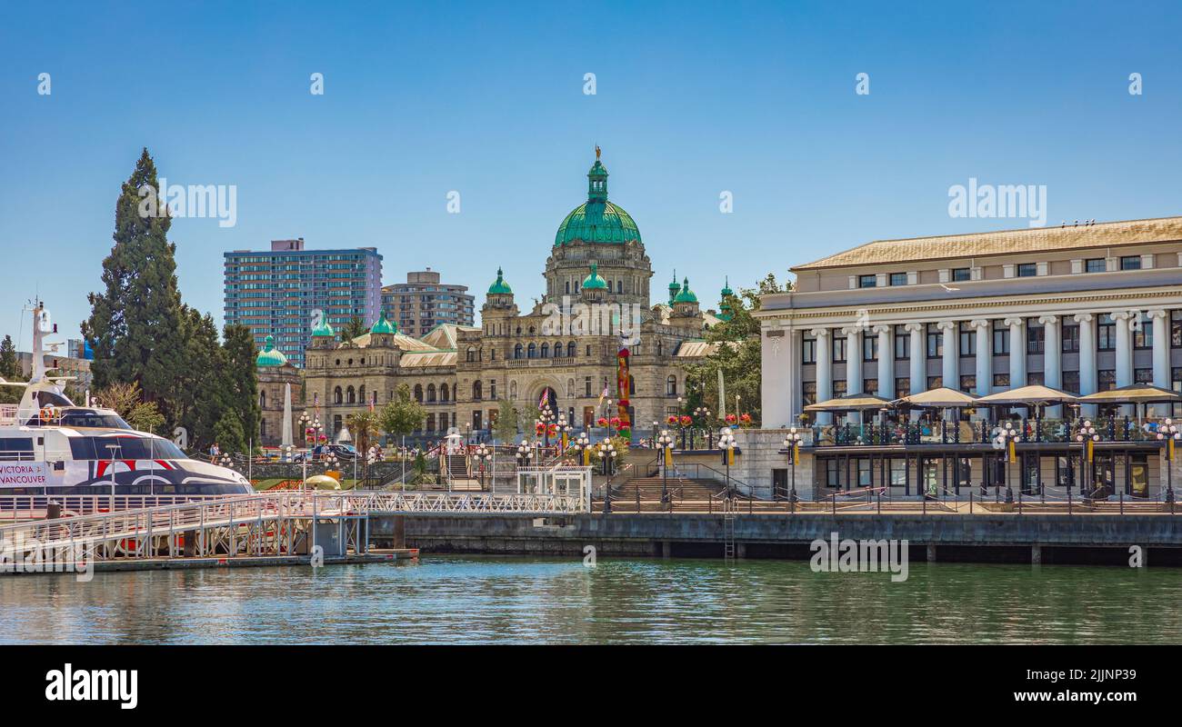 Victoria, British Columbia, Canada. Victoria Harbour and Parliament Buildings at sunny summer day. Inner Harbour, Popular tourist destination with eco Stock Photo