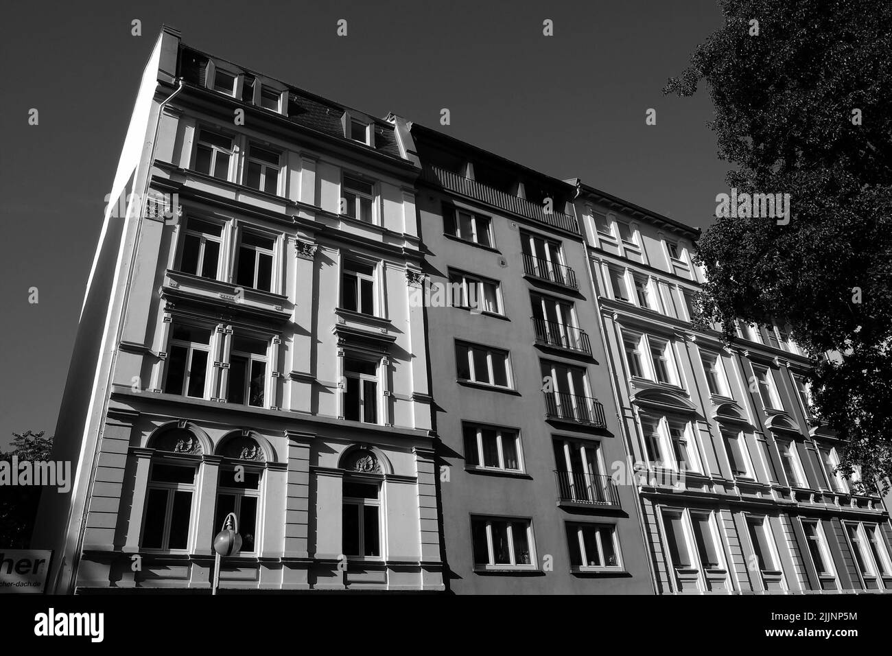 A grayscale of a new residential building on a sunny morning Stock Photo