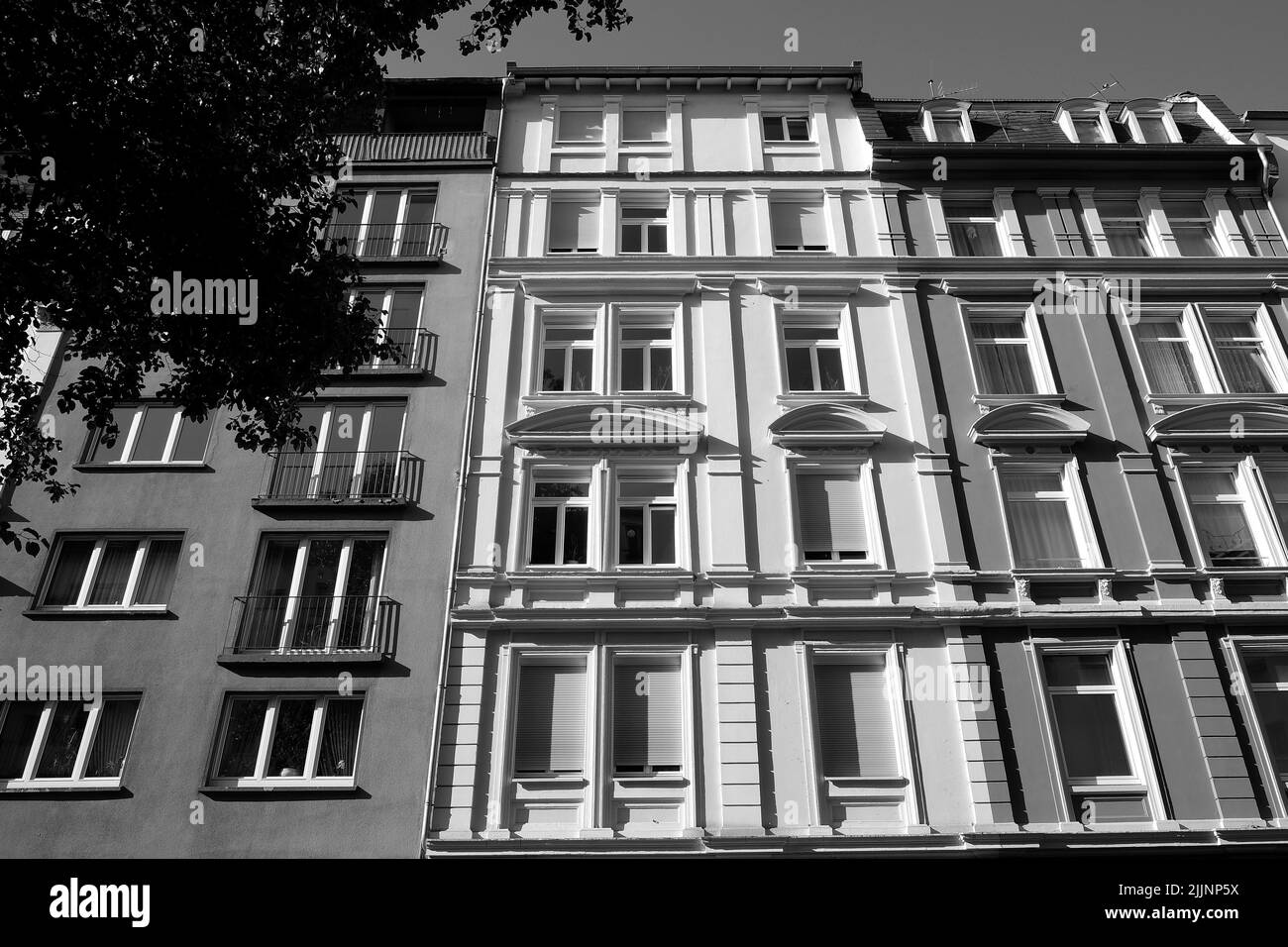 A grayscale of a new residential building on a sunny morning Stock Photo