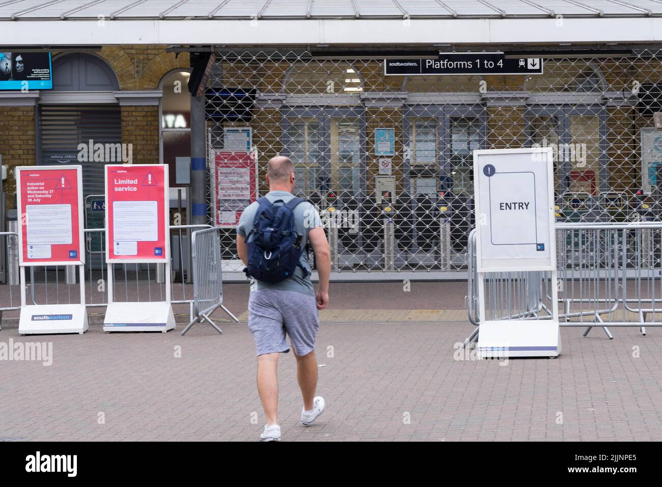 London UK, 27th July 2022.  commuter looking for train home at Southeastern railway station at Lewisham is shut as more than 40,000 members of the RMT union working at Network Rail among14 train operators are on strike today across the UK. Credit: glosszoom/Alamy Live News Stock Photo