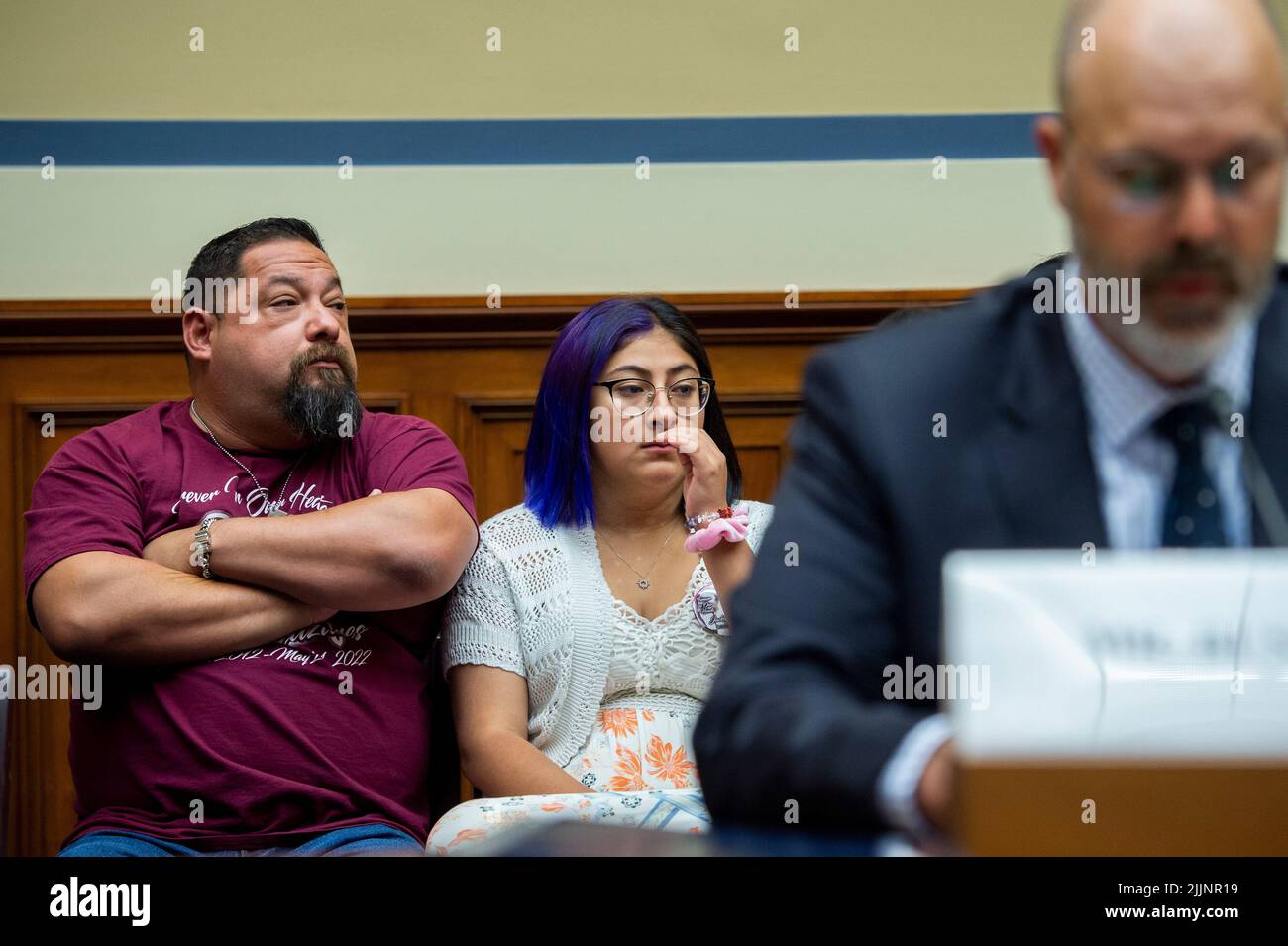 Washington, Vereinigte Staaten. 27th July, 2022. Jazmin Cazares, center, whose nine year-old sister Jacklyn Cazares, was one of the children killed by a gunman at Robb Elementary School in Uvalde, Texas, is seated next to her father Javier Cazares, left, during a House Committee on Oversight and Reform hearing âExamining the Practices and Profits of Gun Manufacturersâ in the Rayburn House Office Building in Washington, DC, July 27, 2022. Credit: Rod Lamkey/CNP/dpa/Alamy Live News Stock Photo