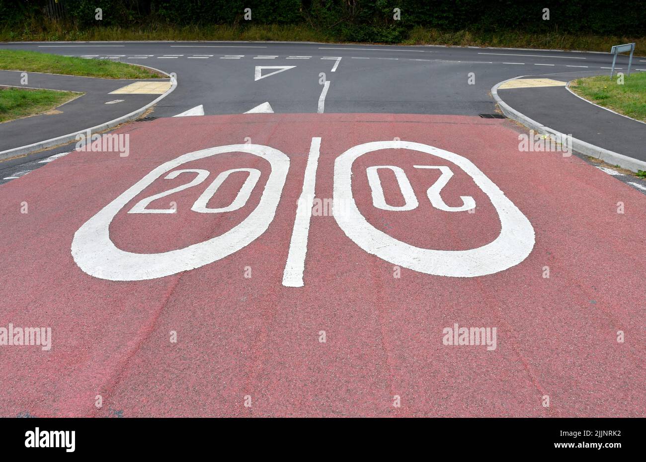 Road markings showing a 20 mph speed limit at the approach to a