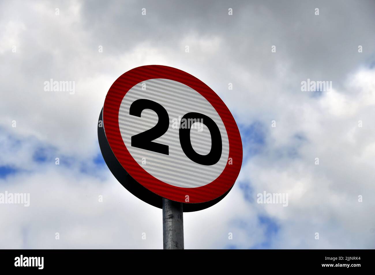 Road sign showing a 20 mph speed limit at the approach to a residential area Stock Photo Alamy
