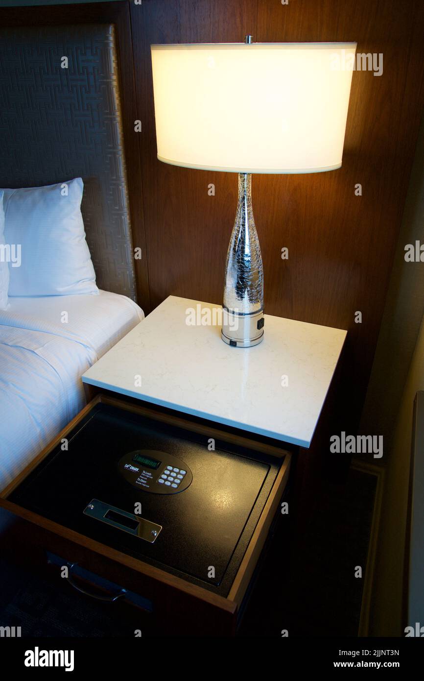 CHICAGO, ILLINOIS, UNITED STATES - May 12, 2018: Luxury hotel room with safe in nightstand drawer Stock Photo