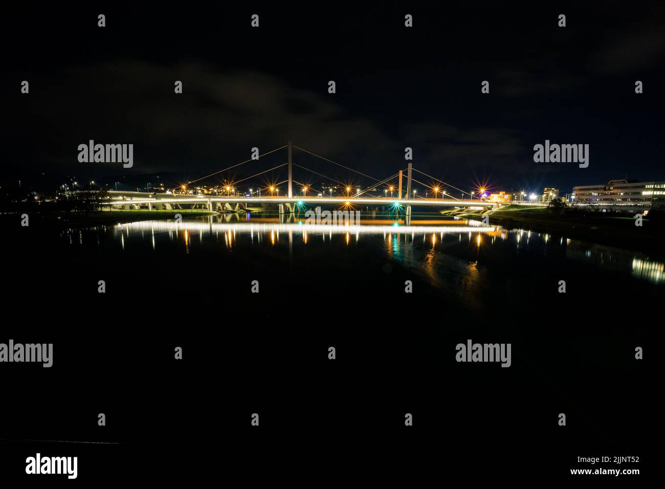 a night photo of bridges over the river Stock Photo - Alamy
