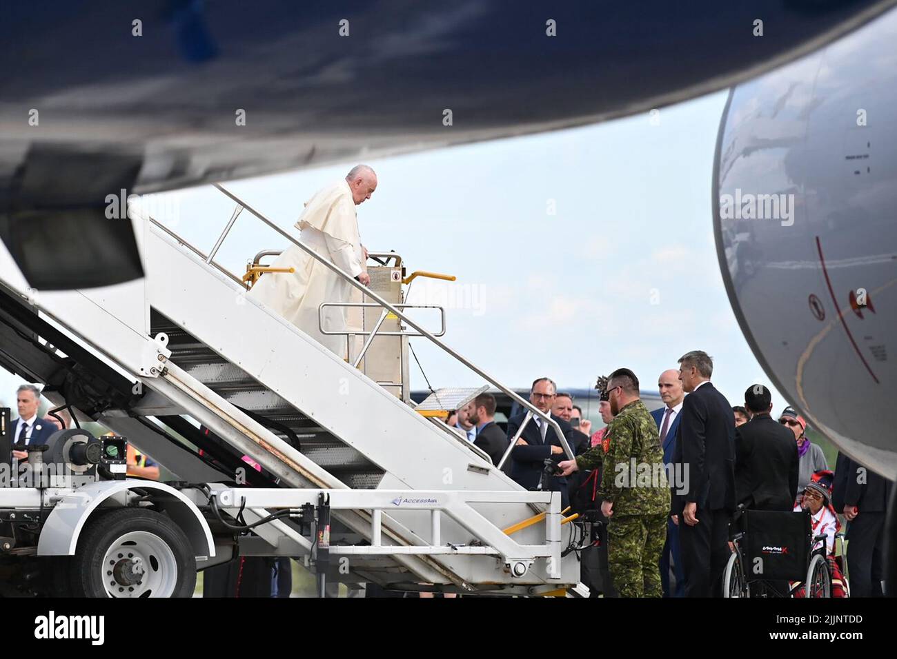 Quebec, Canada. 26th July, 2022. Pope Francis stands on a hoist during his arrival by plane at the Québec airport. As part of his six-day trip to Canada, Pope Francis plans to celebrate Mass at the National Shrine and meet church officials in Quebec City this Thursday. Credit: Johannes Neudecker/dpa/Alamy Live News Stock Photo
